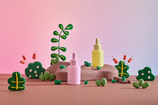 Product bottle displayed on plasticine clay podium decorated