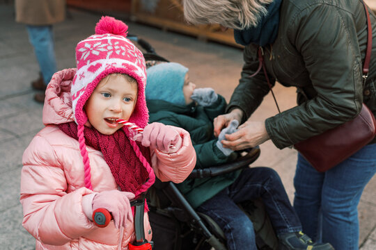 Daydreaming in Pink: Little Girl with Candy Cane