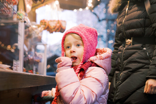 Daydreaming in Pink: Little Girl with Candy Cane