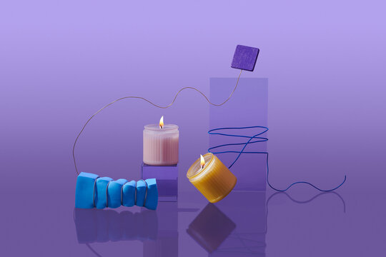 Soy candles are burning in a jar.