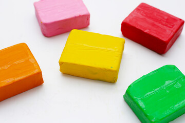 Colorful plasticine clay on white background.