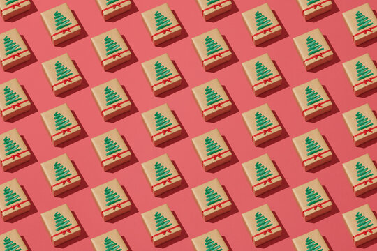 Repetitive pattern of Christmas gift boxes wrapped in craft paper