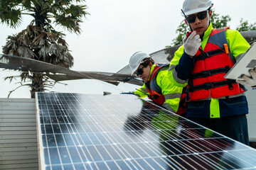 engineer men inspect modules of photovoltaic cell panels. Industrial Renewable energy of green...