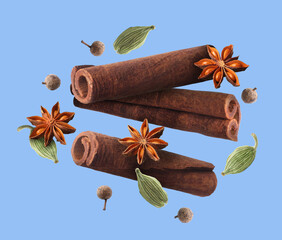 Cinnamon sticks and other aromatic spices falling on blue background