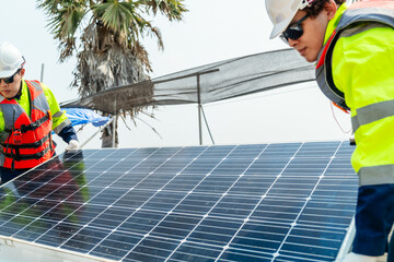 Workers Technicians are working to construct solar panels system on construction site. engineers are checking before Instal solar photovoltaic panel system. Renewable clean energy technology concept.