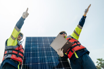 Workers Technicians are working to construct solar panels system on construction site. engineers...