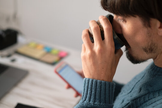 A man working on a laptop from home