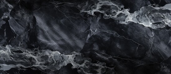 A black and white marble texture background, showcasing intricate patterns and contrasts between...