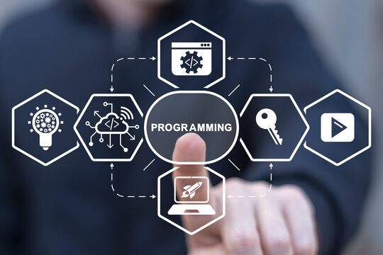 Man using virtual touch screen presses word: PROGRAMMING. Concept of computer programming or developing software, game, apps. Artificial coding, programming, information technologies.
