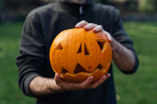 Man with pumpkin during Halloween