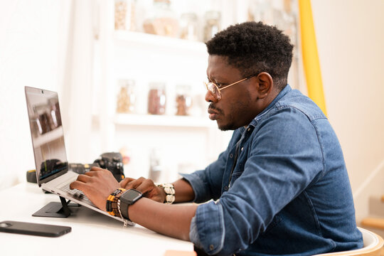 A photographer editing his work