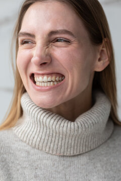 White girl smiling in transparent dental aligners 