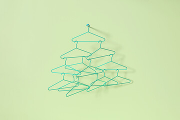 Simple metal hangers hooked one by one.