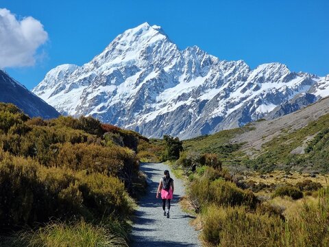 Hiking on trail in towards the mountains