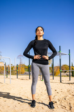 Fit happy sportsWoman in activewear looking at camera