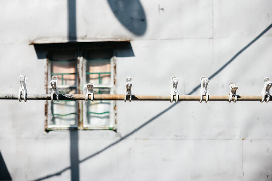 Set of clothes hangers located on a clothesline pole