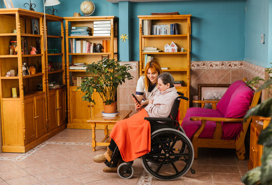 nurse accompanying a woman resident in a centre for the disabled