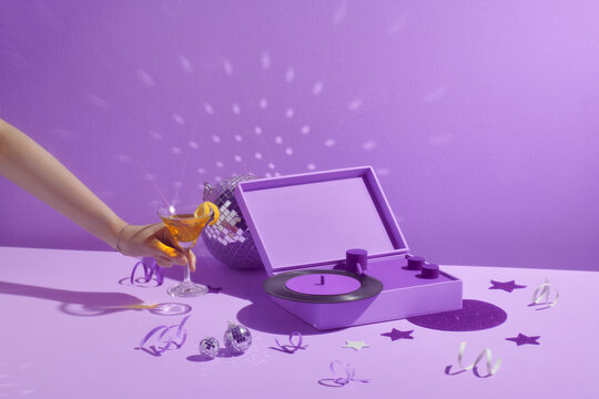 Glass with martini on dj controller in party concept