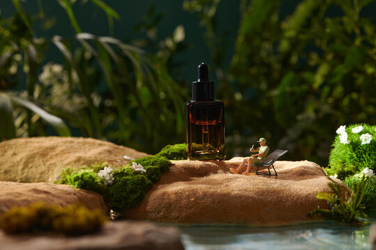 Brown cosmetic jar made of glass on a forest green natural moss