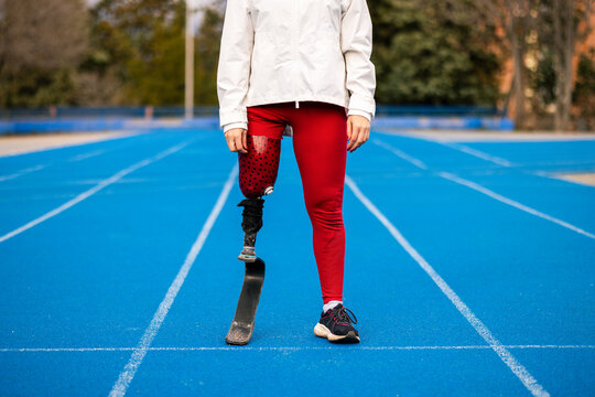 Lower body of paralympic woman athlete with bionic leg prosthesis 