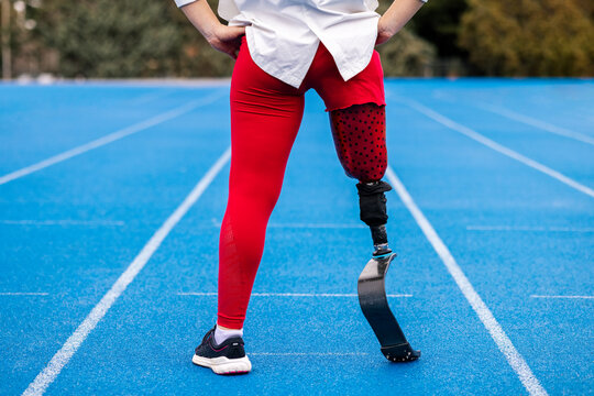 Lower body of paralympic woman athlete with bionic leg prosthesis 