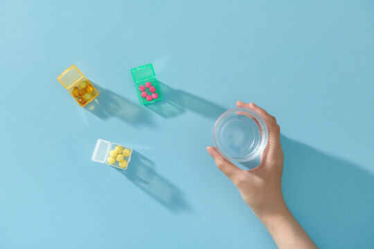 The medical pill boxes with doses of tablets for daily medicine