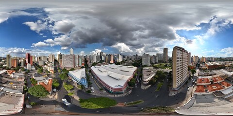 360 aerial photo taken with drone of large building where city's original market is held and a dark...