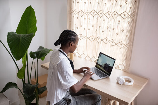 Focused female structural engineer working on computer