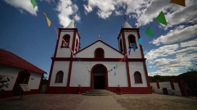 Facade of Mexican Our Lady of Guadalupe church, with two towers and clear blue sky, in former mining town El Triunfo, Baja California Sur, Mexico