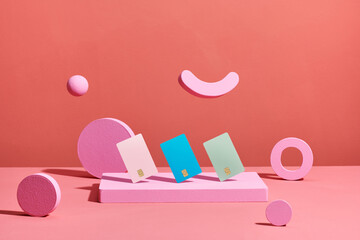 Bank cards on a geometry pink podium