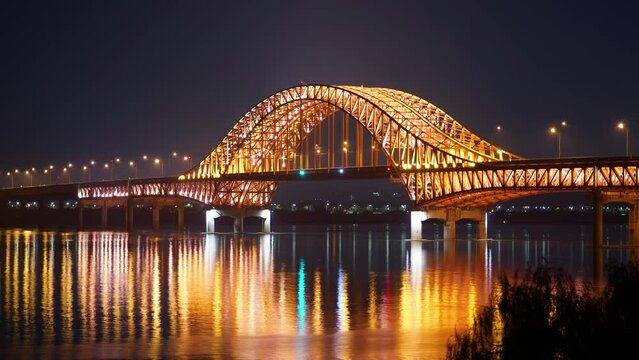 Banghwa Bridge road traffic at night in Banghwa-dong, Han River, Seoul, South Korea