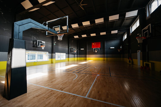 Basketball court with sunlight on the floor