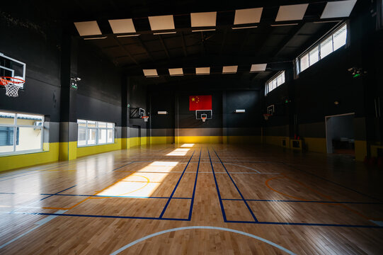 Basketball court with sunlight on the floor