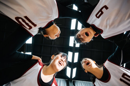 Portrait of female students in basketball uniform