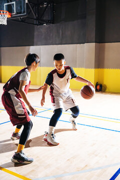 Rivalry on basketball field between teenagers 