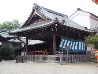 Serene Summer: Japanese Shrine (Jinja) in the Tranquil Season image of the Yasaka-jinja Shrine, a red shinto shrine in Kyoto, Japan