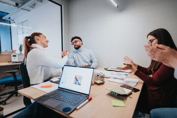 Business professionals having meeting, collaborate in a creative office, discussing market expansion, analyzing statistics, and reviewing sales reports.