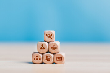 Onboarding concept. Wooden block with onboarding icon for human resources business industry to introduce newly hired employee into an organization with behavior, welcome, knowledge, and skills