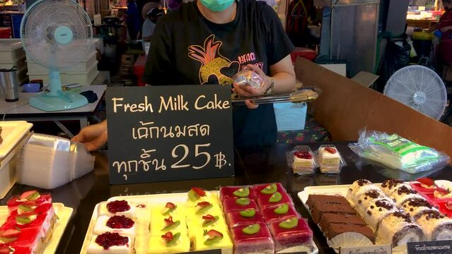 March 5, 2022 - Thepprasit Night Market, Pattaya Thailand.  Various cakes and treats being sold by a vendor at to tourists and locals.