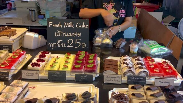 March 5, 2022 - Thepprasit Night Market, Pattaya Thailand.  Various cakes and treats being sold by a vendor at to tourists and locals.