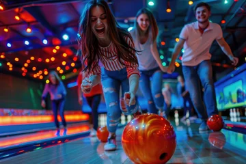Foto op Plexiglas Group of young people having fun playing bowling © Kien
