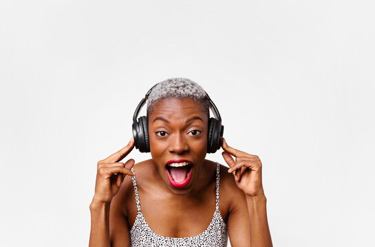 Horizontal portrait of woman listening to music in headphones