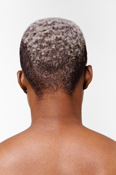 Back of a woman's head with short white hair