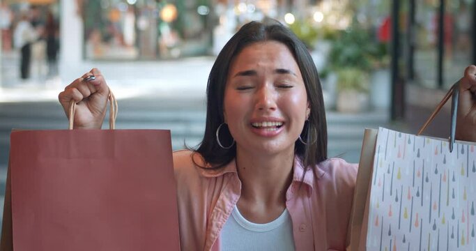 In shopping mall woman's pleasure evident as she displays shopping bags Pleasure finding perfect items her smile bright. Pleasure shopping symbol joy feminine beauty Essence happiness.