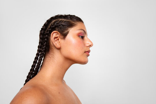 Profile of a young woman with braided hairstyle
