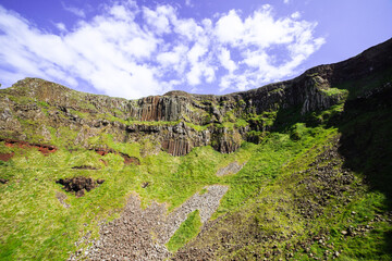 The iconic hexagonal basalt columns rise majestically from the coastal waters.