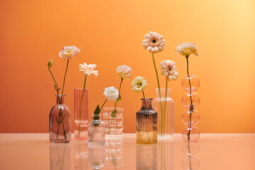 Beautiful color gerbera flowers in transparent vases