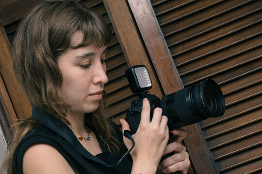Woman looking at her camera