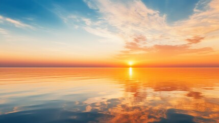 golden sky at sunset Reflected on the vast sea surface It conveys tranquility. and the grandeur of...