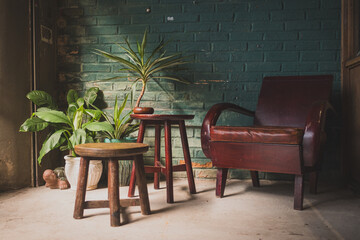 wooden table and chairs set with green plants